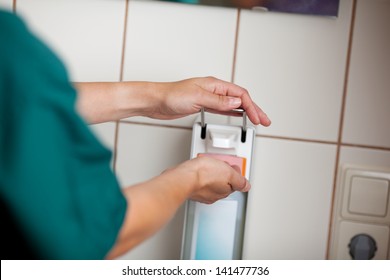 Cropped image of female surgeon using handwash in hospital - Powered by Shutterstock