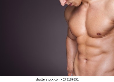 Cropped Image Of Fit Man Showing Six Pack Abs