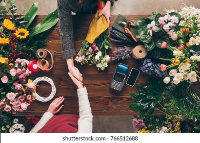 Cropped Image Of Florist And Customer Shaking Hands