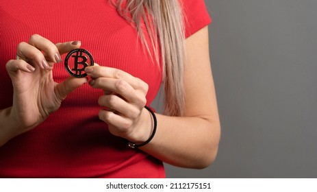 Cropped Image Golden Physical Bitcoin In Woman Hand. Digital Currencies, Cryptocurrencies, Blockchain. Capital Investment. Investment Adviser. Financial Literacy. Equity Trade