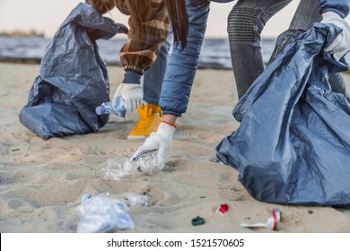 Cropped Image Group Of Volunteers Cleaning Up Beach Line