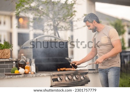 Similar – Image, Stock Photo Crop cook preparing meat and hotdog on grill machine
