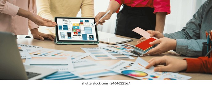 Cropped image of interior designer team chooses color from color swatches while tablet displayed UI and UX designs for mobiles app and website. Creative design and business concept. Variegated. - Powered by Shutterstock