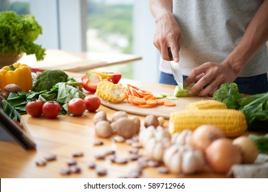 Cropped Image Of Man Cooking Vegetarian Meal