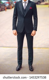 Cropped Image Of A Man In A Men's Suit In A Street. Front View. No Face