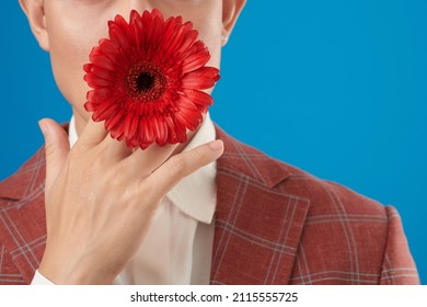 Cropped Image Of Man In Suit Holding Red Flower In Mouth