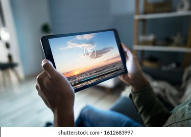 Cropped Image Of Man Watching Movie On Digital Tablet At Home - Shutterstock ID 1612683997