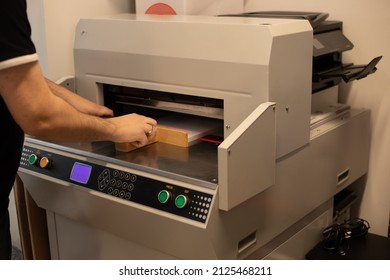 Cropped Image Man Worker Hands Paper Cutter Machine, Guillotine Offset. Level Stack Papers Tray Pusher. Manufacture