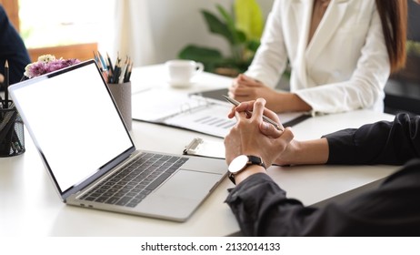 Cropped Image, The Meeting Concept, Business People Having The Meeting In Conference Room, Laptop White Screen Mockup.