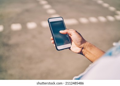 Cropped image of millennial user checking received smartphone notification for updating cellphone system, selective focus on modern cellular gadget with browsed website for reading publication content - Shutterstock ID 2112485486