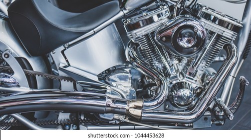 Cropped image of new motorcycle in shop. Motorcycles and accessories in modern motorcycle custom store. Biker stuff - Powered by Shutterstock