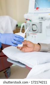 Cropped Image Of Nurse Giving Crushed Ice To Patient On Renal Dialysis In Hospital Room