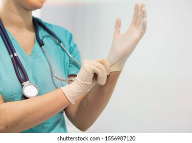 Cropped Image Of Nurse Wearing Gloves In Clinic