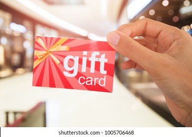 Cropped Image Of Person's Hand Holding Gift Card