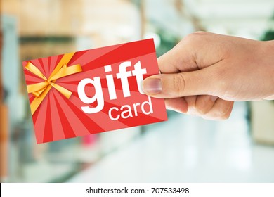 Cropped Image Of Person's Hand Holding Gift Card