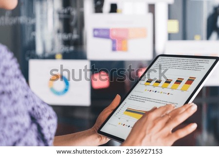 Cropped image of professional marketer working with analytic revenue and web infographics displayed on touch pad screen, businesswoman using wireless internet connection for analyzing diagram