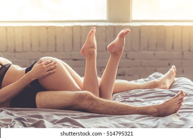 Cropped Image Of Sensual Beautiful Young Couple Having Sex On Bed