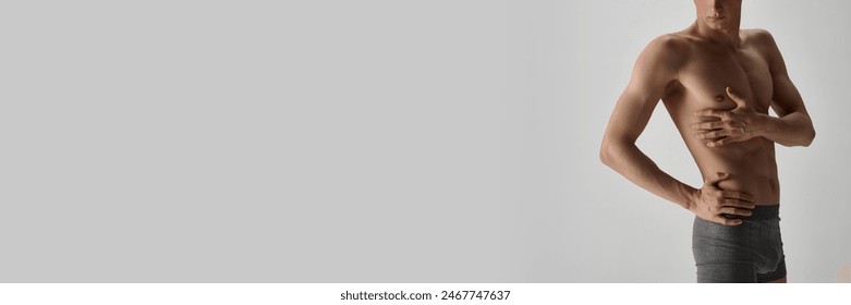 Cropped image of shirtless fit male body in underwater isolated on grey studio background. Health care and medicine. Concept of male beauty, body care, fitness, sport, health. Banner for ad - Powered by Shutterstock