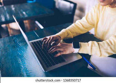 Cropped image of skilled female it professional working at online platform for programmers connected to wifi internet on modern laptop device, woman typing data information during freelancing - Powered by Shutterstock