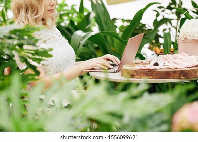 Cropped Image Of Small Online Cosmetics Store Owner Working On Laptop And Answering E-mails Of Customers