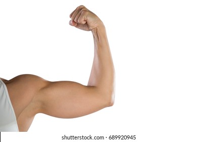 Cropped image of sportswoman flexing muscles against white background - Powered by Shutterstock