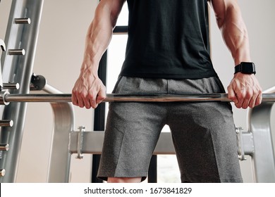 Cropped Image Of Strong Fit Man Lifting Barbell In Gym And Doing Romanian Deadlift