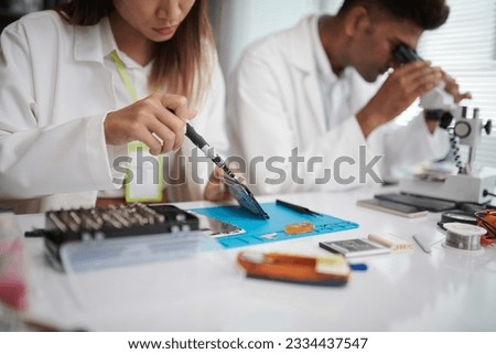 Cropped image of technician disassembling computer hard drive