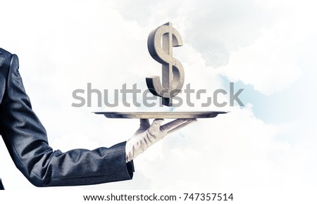 Cropped image of waiter's hand in glove presenting stone dollar symbol on metal tray with blue cloudy skyscape on background. 3D rendering.