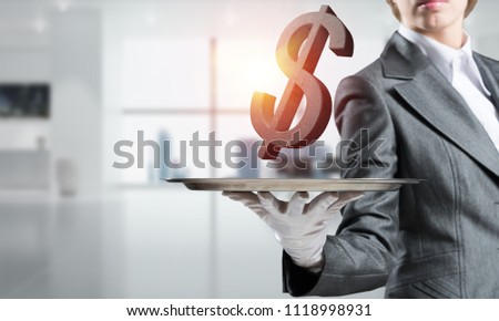 Cropped image of waitress's hand in glove presenting stone dollar symbol on metal tray with office view on background. 3D rendering.