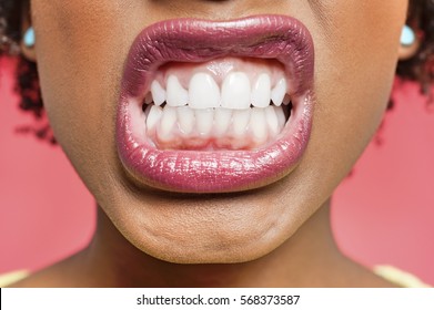 Cropped Image Of Woman Clenching Teeth