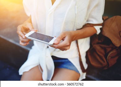 Cropped Image Of A Woman Hands Holding A Cell Telephone For Navigation Data During Her Summer Trip, Female Using Smart Phone For View On The Location Map Interesting Places To Continue Her Adventure