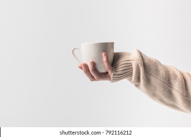 Cropped Image Of Woman Holding Cup Of Coffe In Hand Isolated On White