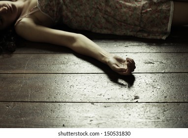 Cropped Image Of A Woman Lying On The Floor