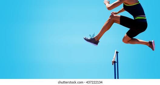 cropped image of woman practicing show jumping against blue background - Powered by Shutterstock