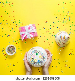 Cropped Image Of Woman Putting Birthday Cake On A Table