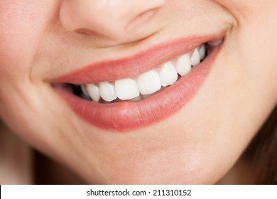 Cropped image of young beautiful woman smiling