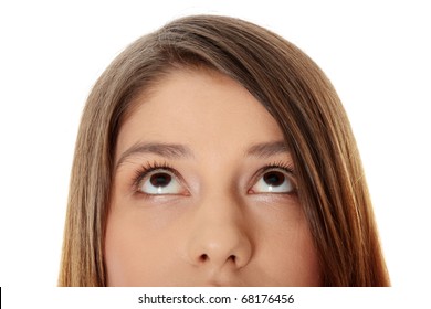 Cropped Image Of A Young Girl With Her Eyes Looking Up, Isolated On White Background