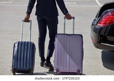 Cropped Man Holding Suitcases, Black Doorman Or Bellboy Help Clients Of Hotel To Carry Baggage