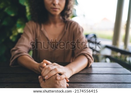 Cropped man and woman holding hands each other during date time for communicate and talking, unrecognizable couple praying togetherness during spiritual assistance and ritual patience for support