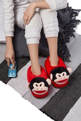 Cropped Medium Shot Of A Child In White Textured Pyjamas And Red Plush House Slippers Made In The Form Of Monkey Head. The Child With A Blue Car Is Sitting On The Striped Carpet And A Gray Plaid.