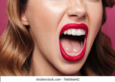 Cropped Photo Of Angry Woman With Red Lips Screaming Isolated Over Pink