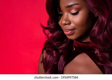 Cropped photo of attractive dark skin young woman empty space dream mood isolated on red color background