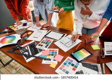 Cropped Photo Of Creative People Prototyping New Web Site Design For A Client While Having A Meeting In The Modern Office. Creative Agency Concept