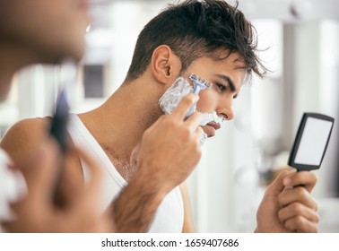 Cropped Photo Of Handsome Male Shaving While Using Foam And Razor Stock Photo