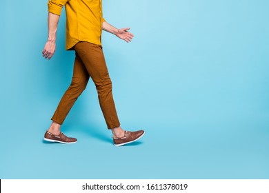 Cropped photo of man going towards empty space in brown shoes trousers pants trendy trend stylish isolated over blue pastel color background - Shutterstock ID 1611378019