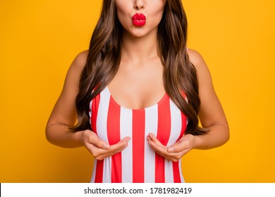Cropped photo of pretty lady bronze body skin red lips send kisses touch big tempting boobs chest swimwear push-up effect wear striped bodysuit isolated bright yellow color background