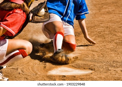 Cropped Photo Of Softball Player Sliding Into Home Plate