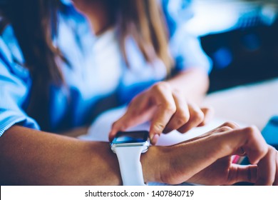 Cropped Picture Of Woman Sitting At Desktop And Checking Notification On Digital Wearable Wrist Watch, Selective Focus On Female Hands And New Modern Smartwatch Looking For Time To End Of Work