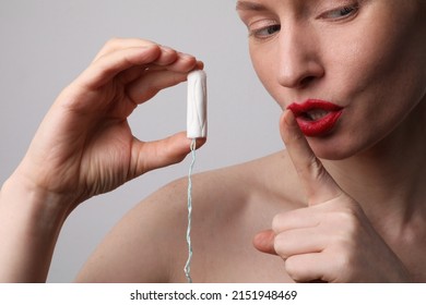 Cropped Portrait Of Beautiful Woman Is Holding Tampon And Showing Shhh Sign.