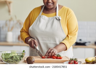 Cropped Portrait Of Black Woman Cooking Healthy Meal In Kitchen And Cutting Vegetables